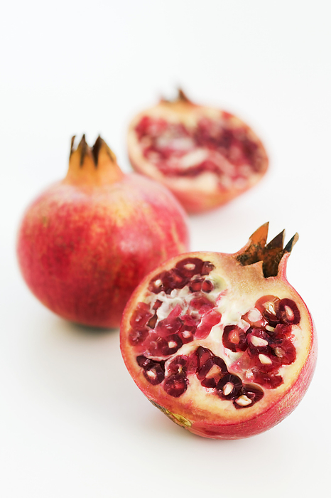 Pomegranate Pomegranate fruit  Punica granatum  sliced in half showing the seeds.
