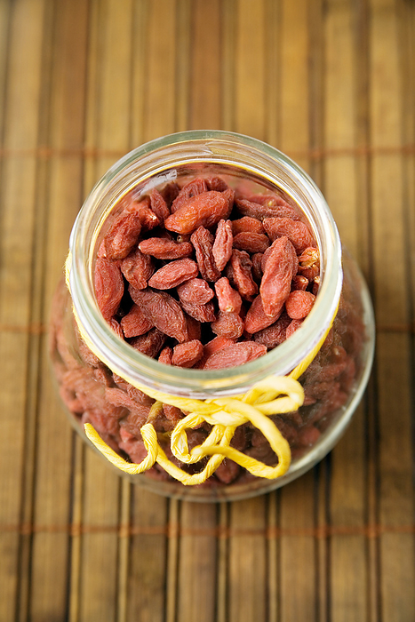 Goji berries Goji berries. Jar containing dried goji berries  Lycium sp. . This fruit is used in Chinese Medicine and it also eaten as a health food as a source of antioxidants.