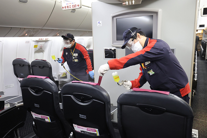 Japan Airlines  JAL  workers disinfect their aircraft cabin to protect from the coronavirus April 23, 2021, Tokyo, Japan   Workers of Japan Airlines  JAL  spray anti virus and anti bacteria agent to the passenger seats and aircraft cabin including toilets at a hanger of JAL at the Haneda airport in Tokyo on Friday, April 23, 2021. Japan s airlines are struggling their business since the government will declare the COVID 19 state of emergency on Tokyo, Osaka, Kyoto and Hyogo prefecture during the Golden Week holidays.     Photo by Yoshio Tsunoda AFLO  
