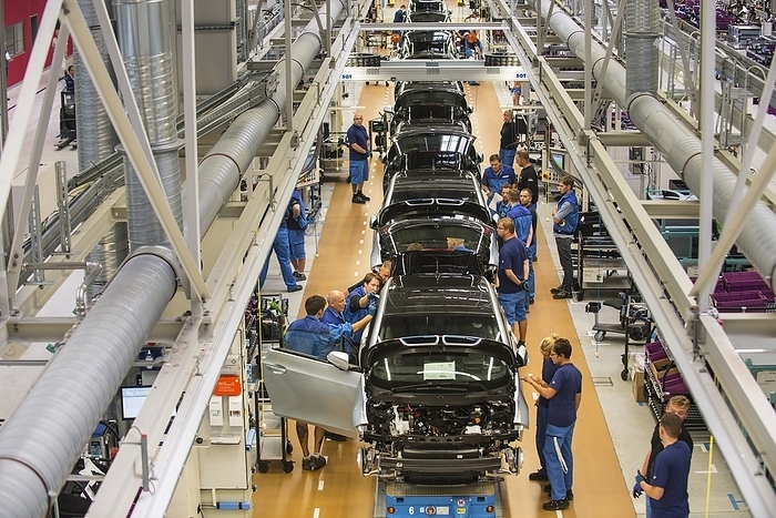 Production line in a car factory Production line in BMW car factory, Leipzig, Germany., by PHILIPPE PSAILA SCIENCE PHOTO LIBRARY