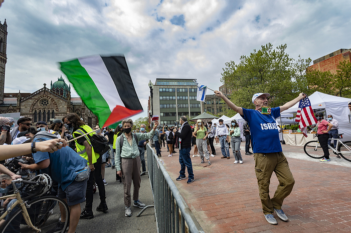 Boston protest for Palestine rally May 15, 2021, Boston, Massachusetts, USA: Lone pro Israel counter protester holds Israeli and US flags while hundreds people rally in solidarity with the Palestinian people amid the ongoing conflict with Israel during Boston protest for Palestine rally in Boston.  Photo by Keiko Hiromi AFLO  