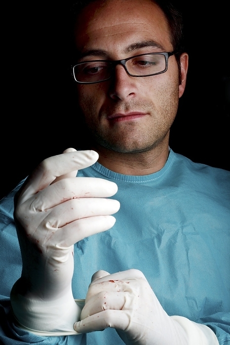 Pathologist Pathologist adjusting his gloves.
