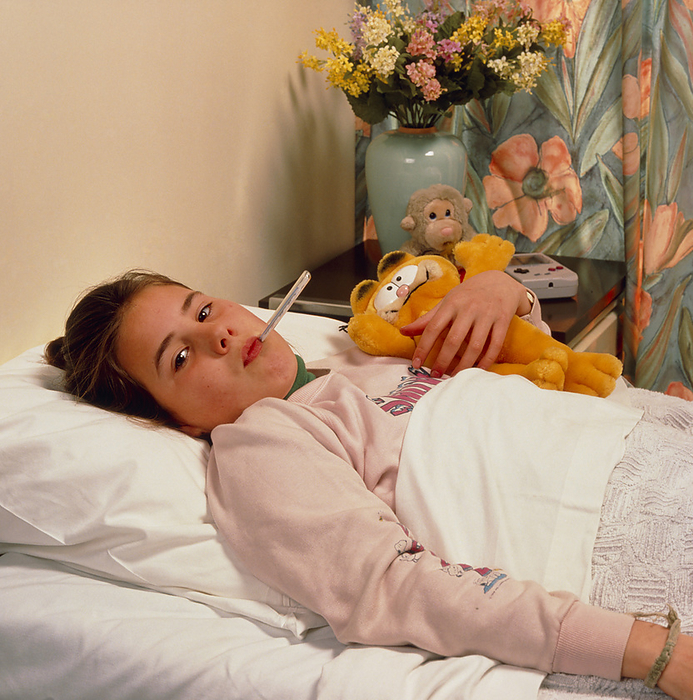 Young girl in hospital having temperature taken Taking temperature. A young girl lies in a hospital bed with a thermometer in her mouth. Temperature is a useful indicator of health as it rises during a serious infection as part of the body s immune response. A fever is defined as an oral temperature of over 37 degrees Celsius. The average temperature of a healthy individual is 36.5 37.2 Celsius.