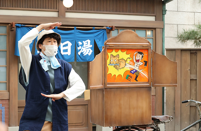 Seibuen Yuenchi Renewed Media Preview May 18, 2021, Tokorozawa, Japan   An actor performs as a storyteller with picture cards at the renovated Seibuen amusement park which has the  Showa Retro , post WWII period atmosphere shopping arcade at a press preview in Tokorozawa, suburban Tokyo on Tuesday, May 18, 2021. Seibuen amusement park, closed temporarily last year for fully renovation, will reopen on May 19 with the new attractions.      Photo by Yoshio Tsunoda AFLO  