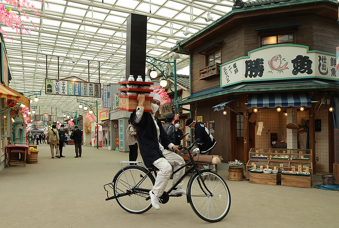 Seibuen amusement park is fully renovated and will reopen with the new attractions May 18, 2021, Tokorozawa, Japan   An actor performs as a delivery man of a noodle shop at the renovated Seibuen amusement park which has the  Showa Retro , post WWII period atmosphere shopping arcade at a press preview in Tokorozawa, suburban Tokyo on Tuesday, May 18, 2021. Seibuen amusement park, closed temporarily last year for fully renovation, will reopen on May 19 with the new attractions.      Photo by Yoshio Tsunoda AFLO  