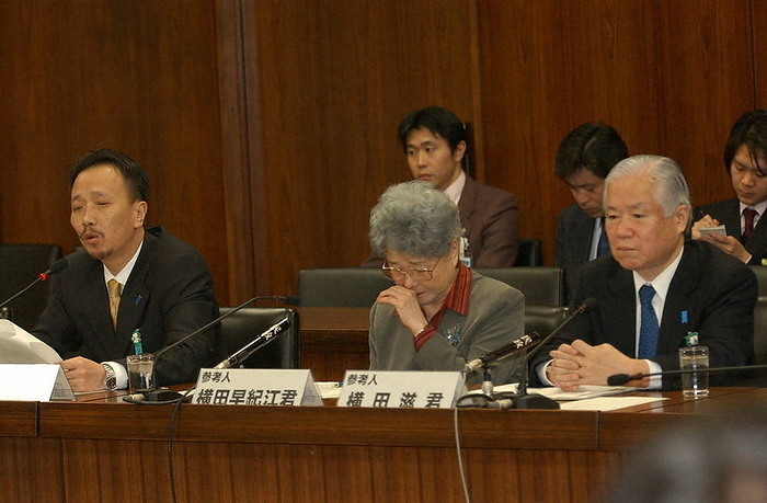 North Korean abduction case:  Solve the problem as soon as possible    Sakie Yokota wipes away tears while Toru Hasuiike  left  speaks. Sakie Yokota wipes away tears during remarks by Toru Hasuiike  left , who attended the House of Representatives Foreign Affairs Committee subcommittee as a witness. Her husband Shigeru is on the right.