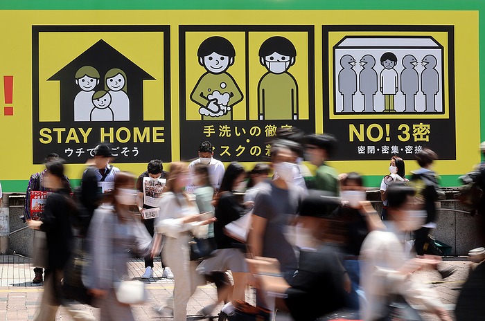 People visit Tokyo s Shibuya fashion district under a state of emergency June 5, 2021, Tokyo, Japan   People walk in front of a large notice to avoid COVID 19 at Tokyo s Shibuya fashion district amid outbreak of the new coronavirus on Saturday, June 5, 2021.      Photo by Yoshio Tsunoda AFLO 
