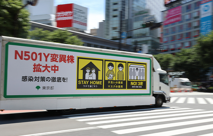 People visit Tokyo s Shibuya fashion district under a state of emergency June 5, 2021, Tokyo, Japan   An advertisement truck carries a large notice to avoid COVID 19 at Tokyo s Shibuya fashion district amid outbreak of the new coronavirus on Saturday, June 5, 2021.      Photo by Yoshio Tsunoda AFLO 