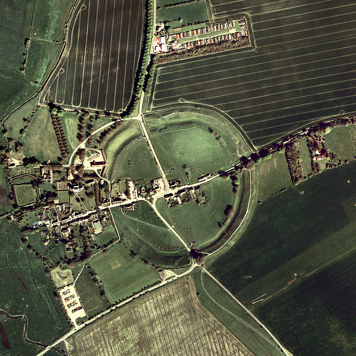 Avebury ring Avebury ring, aerial photograph. The circles of standing stones and the henge  ditch  at Avebury date from about 2500 BC. The entire site encompasses some 28 acres and comprises a perimeter ditch and bank enclosing an outer circle of stones and two inner circles of stones. The ditch and bank are approximately 0.4 km in diameter. The ditch, though still clearly visible, is about a third of its original depth of 10m. Within the perimeter is a circle of Sarsen stones, which have survived best on the western  left  half. Within the outer circle of stone were two smaller stone circles, one to the north and one to the south of the site, now separated by a road. The ring in the southern half has survived best. The site is part of the Avebury World Heritage Site. Photographed in Avebury, Wiltshire, UK.