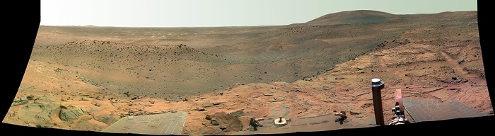 Martian landscape, false colour panorama Martian landscape, false colour panorama, obtained by the Spirit Mars Exploration Rover. This image is of the region known as Home Plate, a rocky outcrop with layered features, which is located in the Columbia Hills of the Gusev Crater. The large mound at upper right is called Husband Hill. Spirit landed on Mars in January 2004. The colours of the image were created by combining three camera filters designed to enhance colour differences in the Martian rocks and soils. The true colour equivalent image is R360 320. This panorama was obtained on 6th 9th November 2007, on days 1366 1369 of the rover s mission.