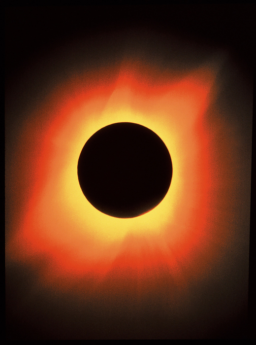 Total solar eclipse, 11 July 1991 Total solar eclipse. The large shining corona of the Sun, seen during the total solar eclipse of 11 July 1991 from Baja California, Mexico. The visible corona is in fact the overlapping K corona and F corona. Usually it is only visible during eclipses, as the light from the Sun s photosphere drowns it out. The K corona consists of fast  moving free electrons at a temperature of about 2 million Kelvin, at heights of about 75,000km above the Sun s surface. The F corona extends for many million km s, and consists mainly of slow moving particles of cosmic dust. The shape of the corona changes during the cycle of solar activity under the influence of the Sun s magnetic field.