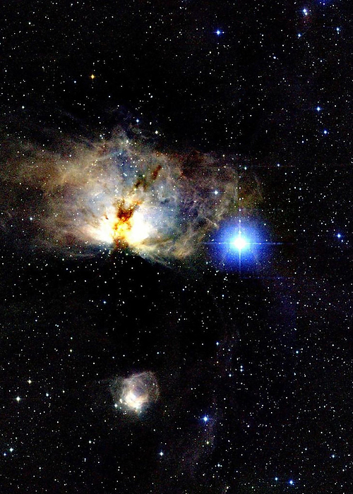 Flame Nebula Flame Nebula. Coloured infrared image of the Flame Nebula, NGC 2024, an emission nebula and site of star formation. A prominent dark dust lane is seen across the centre of the nebula. Toward the bottom of the frame is NGC 2023, a photodissociation region. The bright blue star is Alnitak  zeta Orionis , part of Orion s Belt. The nebula is part of the Orion Molecular Cloud  OMC , a dense star formation region 1470 light years from Earth. This image was made as part of the Two Micron All Sky Survey  2MASS  project.