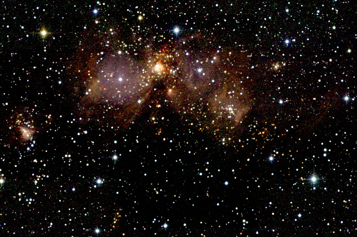 Star forming region Star forming regions. Coloured infrared image of the star forming regions Sharpless 254 to 258. These are regions of on going star formation, with hot ionising stars surrounded by clouds of hydrogen gas. Sharpless 255  just above centre  contains a cluster of high mass, infrared bright young stars which appear red as they are still embedded in a molecular cloud. These objects are part of the Gemini OB1 molecular cloud, about 8150 light years from Earth. This image was made as part of the Two Micron All Sky Survey  2MASS  project.