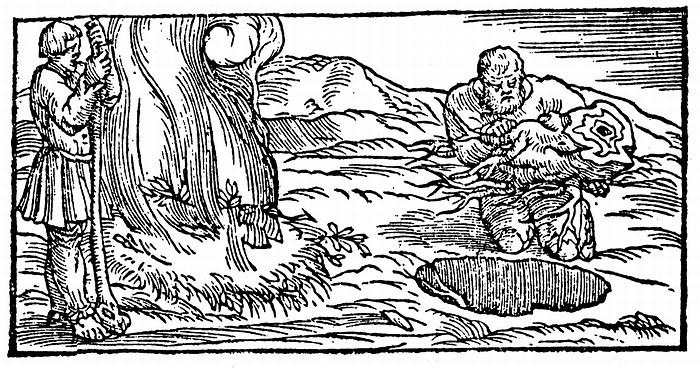 Charcoal burning: Pit being filled with wood (right) covered with earth and bracken, then slowly burned to produce charcoal. Inferior to charcoal burned in heaps. From Biringuccio 'De la Pirotechnia' Venice 1540. Woodcut.