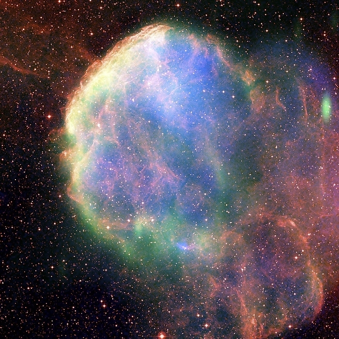Supernova remnant IC 443, composite image Supernova remnant IC 443, composite image. This is a combination of X ray  blue , radio  green  and optical  red  data. A supernova remnant  SNR  is an expanding shell of dust and gas that forms following the explosive death of a massive star. The collision of the ejected material with the interstellar medium is causing the material to heat up and glow. IC 443 is thought to have formed some 8000 years ago. It is around 5000 light years from Earth, in the constellation of Gemini. The data, from January 2005, was obtained by ROSAT and the Chandra X ray telescope  X ray , the Very Large Array  VLA, radio , and the Digitized Sky Survey  DSS, optical .