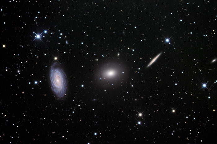 Galaxies  NGC 5985, NGC 5982, NGC 5981  Galaxies  NGC 5985, left, NGC 5982, centre, and NGC 5981, right , optical image. This group of galaxies is located in the constellation Draco. NGC 5985 and NGC 5981 are both spiral galaxies, at distances from the Earth of 120 million light years and 104 million light years respectively. The central galaxy, NGC 5982, is an elliptical galaxy, lying around 134 million light years away.
