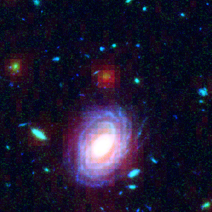 Distant galaxy HUDF JD2, HST SST image Spiral galaxy HUDF JD2, infrared image. The galaxy is at lower centre. It was found in the Hubble Ultra Deep Field  HUDF , which looks at light from many billions of light years away, dating from the early history of the universe. At this distance, the galaxies are often only visible in infrared. After the Hubble Space Telescope had found it, the Spitzer Space Telescope was used to estimate its size. It was found to be one of the most massive galaxies yet observed in the first few hundred millions years of the universe. It was previously thought that such massive galaxies did not form until later on. This image combines HST and SST data obtained in 2003 and 2004. The result was published in 2005.