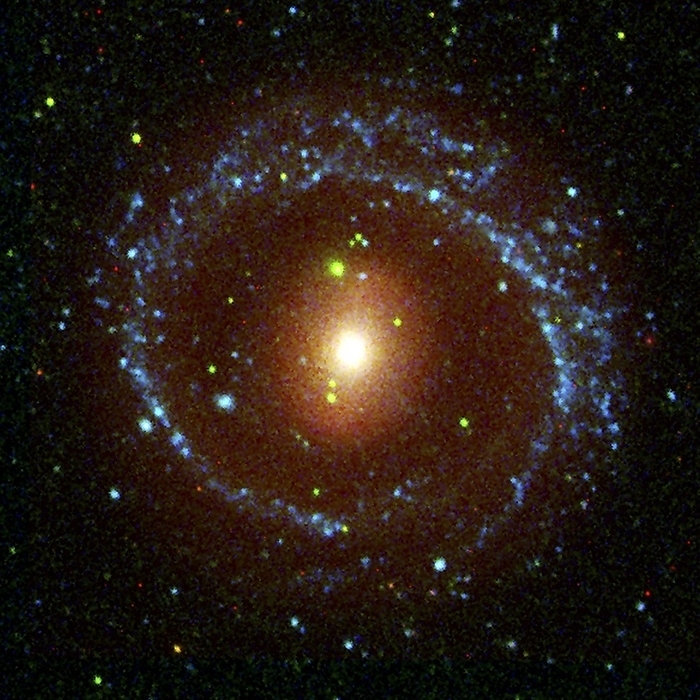 Ring galaxy NGC 1291, composite image Ring galaxy NGC 1291. Ultraviolet  blue  and visible light  red  composite image of the galaxy NGC 1291. This galaxy appears ring shaped due to its circular arms  blue . Its nucleus  red  appears oval, as it is slightly bar shaped. NGC 1291 lies some 33 million light years from Earth, in the constellation Eridanus. Image obtained using the Galaxy Evolution Explorer  GALEX  Orbiter telescope and the Cerro Tololo Inter American Observatory, Chile.
