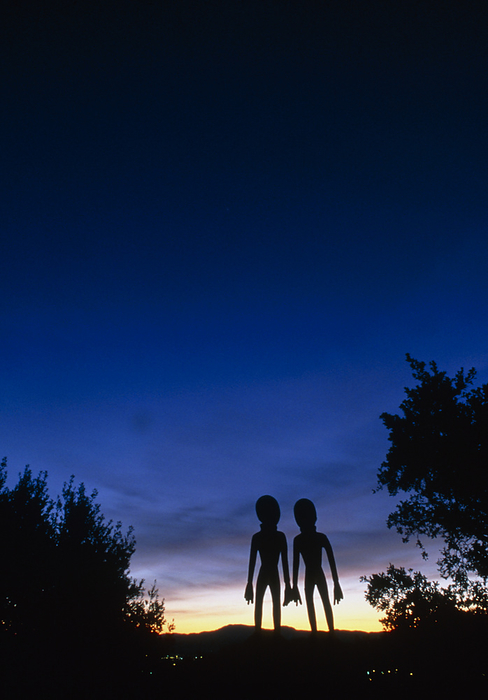 Roswell alien figures watching Hale Bopp comet Roswell  aliens  . Two alien figures watching a faint Hale Bopp comet  upper centre  in the night sky above the town of Roswell, New Mexico, USA. It was near Roswell on the evening of 2 July 1947 that many UFO sightings were reported during a thunderstorm. Next morning a rancher, Mac Brazel, discovered strange wreckage in a field. When the impact site was located, a UFO craft and alien bodies were allegedly found. On 8 July 1947, the Roswell Daily Record announced the capture of a flying saucer. The official explanation was that it was a crashed weather balloon. Many Roswell inhabitants, however, believe this a cover up, and Roswell has become a symbol for UFO enthusiasts. 
