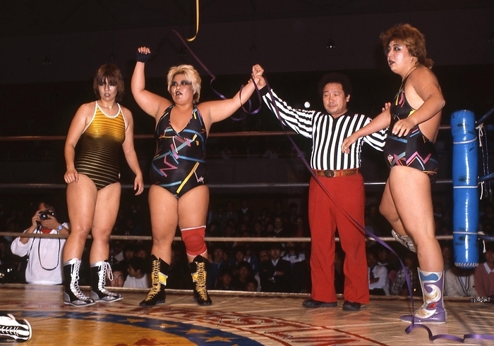 1984 All Japan Women s Pro Wrestling  unknown date  1984 All Japan Women s Pro Wrestling Crane Yu Abe Shiro from the assembled baddie corps  right  Referee Dump Matsumoto Keiko Nakano  Bull Nakano 