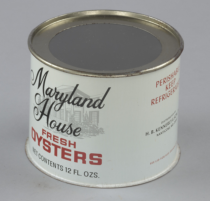 Oyster can used by H. B. Kennerly  amp  Son, Inc., 1935 1950. Creator: Unknown. A twelve ounce tin can for the Maryland House brand of oysters distributed by H. B. Kennerly  amp  Son, Inc. The can is white with red and black text. On the front of the can in the top half is the brand name   x201c Maryland   House  x201d  in black, stylistic font. Behind the text on the front is a light gray graphic of a house with a large, two story portico. Below the graphic in red block text is   x201c FRESH   OYSTERS  x201d  with the net contents of the can printed below that. On the left side of the can printed in red and black text is   x201c PERISHABLE   KEEP   REFRIGERATED   DISTRIBUTED BY   H. B. KENNERLY  amp  SON, INC.   NANTICOKE, MD. 21840   SEE LID FOR SIZE DESIGNATION.  x201d  On the back of the can is black and red text for two recipes. The top of the can includes a clear plastic top.