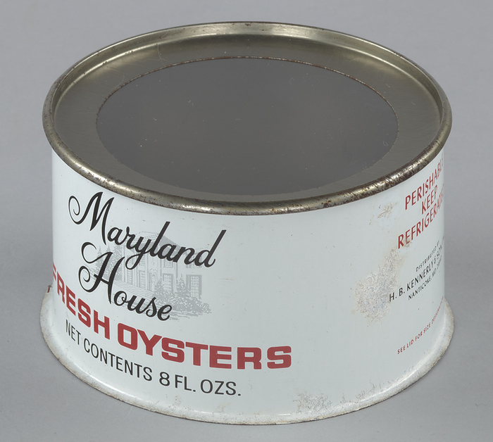 Oyster can used by H. B. Kennerly  amp  Son, Inc., 1935 1950. Creator: Unknown. An eight ounce tin can for the Maryland House brand of oysters distributed by H. B. Kennerly  amp  Son, Inc. The can is white with red and black text. On the front of the can in the top half is the brand name   x201c Maryland   House  x201d  in black, stylistic font. Behind the text on the front is a light gray graphic of a house with a large, two story portico. Below the graphic in red block text is   x201c FRESH   OYSTERS  x201d  with the net contents of the can printed below that. On the left side of the can printed in red and black text is   x201c PERISHABLE   KEEP   REFRIGERATED   DISTRIBUTED BY   H. B. KENNERLY  amp  SON, INC.   NANTICOKE, MD. 21840   SEE LID FOR SIZE DESIGNATION.  x201d  On the back of the can is a recipe for sauteed oysters. The top of the can includes a clear plastic top.