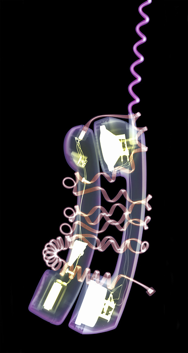 Phone support Phone support. Conceptual coloured X ray of entwined telephone handsets representing the emotional support that can be received through the telephone from a friend.