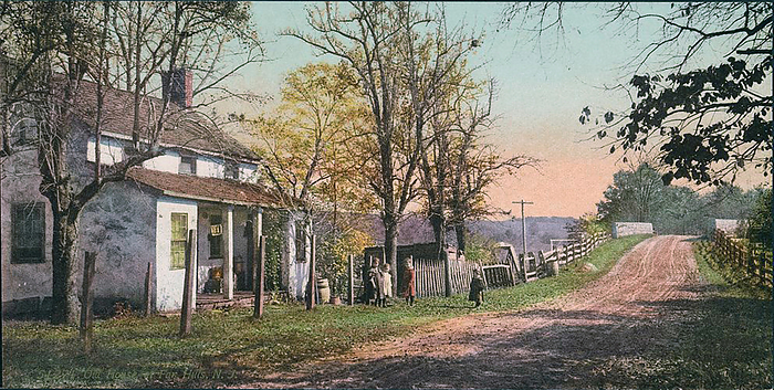 Old house at Far Hills, New Jersey, USA, fronting on to  a road leading towards a bridge. Children playing by the roadside. Photochrome print c1898-c1905.