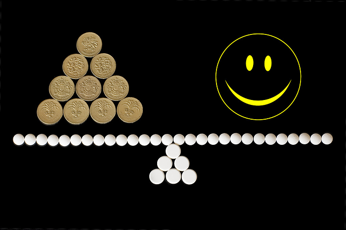 Cost of drugs, conceptual image Cost of drugs, conceptual image. Cost of drugs represented by a seesaw made of pills balancing a happy symbol and a pile of British pound coins.