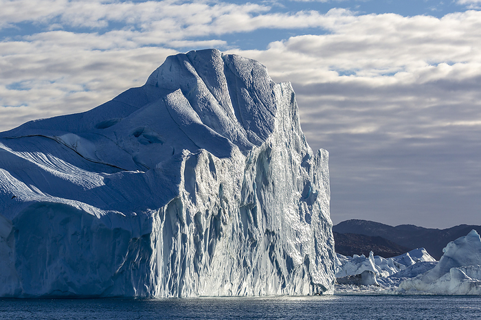 Massive icebergs calved from the Jakobshavn Isbr  glacier, UNESCO World Heritage site, Ilulissat, Greenland. Massive icebergs calved from the Jakobshavn Isbrae glacier, UNESCO World Heritage Site, Ilulissat, Greenland, Polar Regions