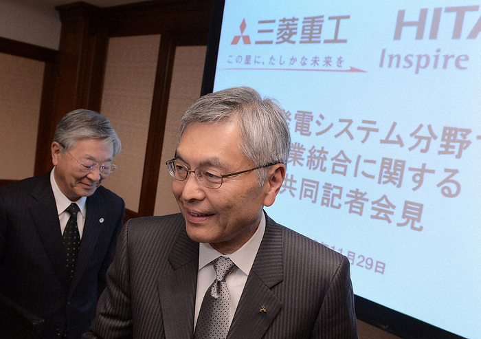 Mitsubishi and Hitachi to Integrate Thermal Power Systems Businesses Press Conference MHI President Hideaki Omiya  foreground  and Hitachi, Ltd. President Hiroaki Nakanishi leave their seats after a joint press conference on the integration of their thermal power generation systems businesses at a hotel in Tokyo on November 29, 2012.