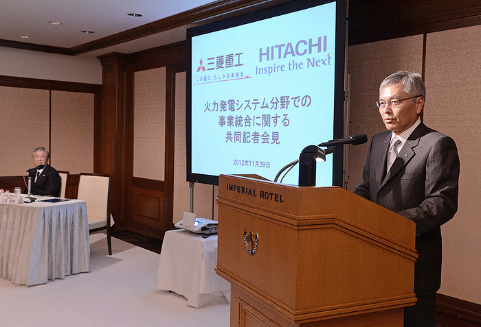 Mitsubishi and Hitachi to Integrate Thermal Power Systems Businesses Press Conference MHI President Hideaki Omiya  right  and Hitachi, Ltd. President Hiroaki Nakanishi  back left  hold a joint press conference on the integration of their thermal power generation systems businesses at a hotel in Tokyo at 4:58 p.m. on November 29, 2012.