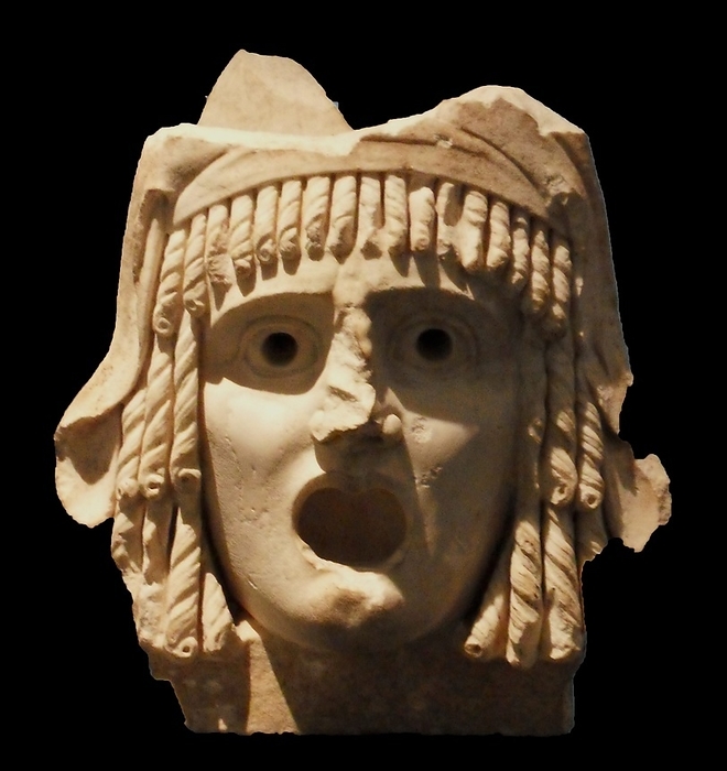 Tragic masks.  Pair of tragic masks, first century BC to first century AD.  A tragic king and a tragic heroine; said to have come 'from a theatre'.  A Roman period rendition in marble of the kind of wooden masks that were worn by actors in classical Greece.