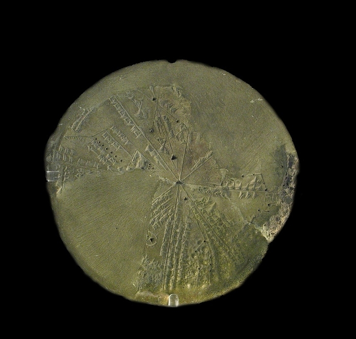 Cuneiform planisphere (star chart).  Objects of this type are sometimes called astrolabes.  The heavens are represented in eight segments which include drawings of the constellations.