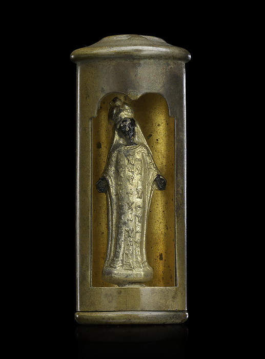 Miniature Black Madonna, 1914 1918. Creator: Unknown. A trench art sculpture featuring a Black Madonna figurine with outstretched arms in the hollow interior of a bullet casing. A rectangle has been cut into the side of the casing with a scalloped edge on top. Inside, a Madonna figure stands in a long gold dress and headdress. The top of the casing has a Christian cross upraised on the metal. Trench art is decorative items made by soldiers, prisoners of war, or civilians during times of conflict. The materials used reflect the availability of media, and the works of art give an insight into to the feelings and emotions of the makers.