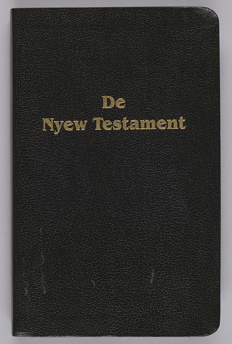 De Nyew Testament, 2005. Creator: Unknown. Translation into Gullah of the New Testament. Gullah refers to African American people and their language in the Lowcountry region of the US states of Georgia, Florida, South Carolina, North Carolina and the Sea Islands. Gullah is also referred to Geechee or Sea Island Creole. Bible with marginal text of the King James Version. Small blue ribbon attached to spine at top to be used as bookmark. Book was published by the American Bible Society.
