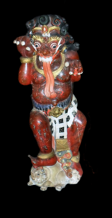 Balinese (Indonesia) Hindu carving in wood. Early 20th Century. (left). Buta, a demon in Hindu mythology. Red symbolises anger and lust.