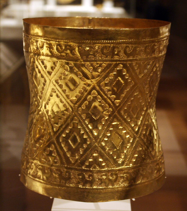 Crown. Peru: Sican (Lambayeque) 9th-11th century.  Hammered gold. In the burial of a high-status Sican lord, archaeologists discovered 1.2 tons of grave goods, including a large treasure box that held more than sixty ornaments of sheet gold. Most were head ornaments.