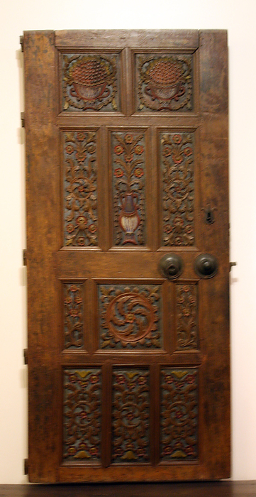 Wood-carved door from a mansion on Rhodes.  18th century wood-carved decoration with coloured floral motifs.