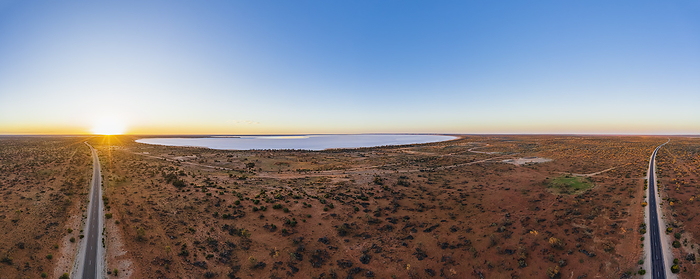 Australia Australia, South Australia, Aerial view of Stuart Highway and salt lake in Lake Hart Area at sunset