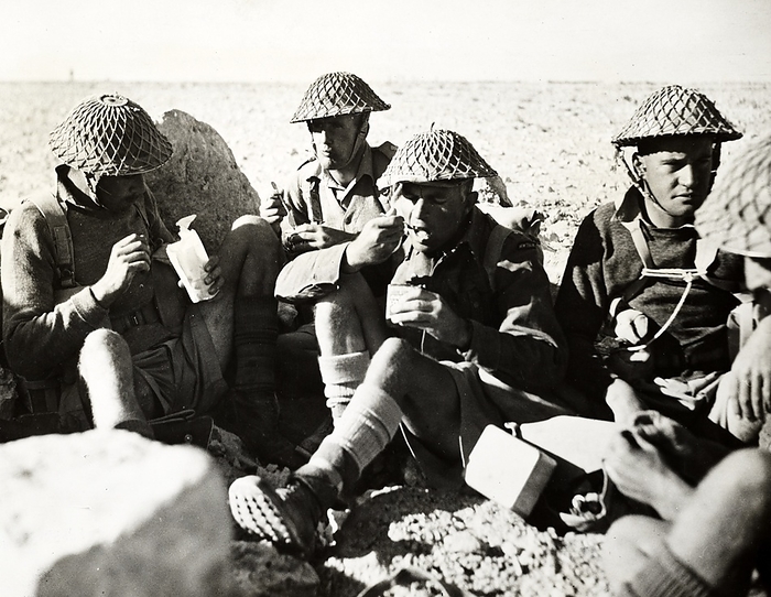Men of the New Zealand Division during the fighting in Crete 1942 Men of the New Zealand Division in the Western Desert take time out for lunch. In centre, spoon to mouth, is Second Lieutenant Charles Kazlett Upham, awarded the V.C. for his remarkable exploits during the fighting in Crete 1942