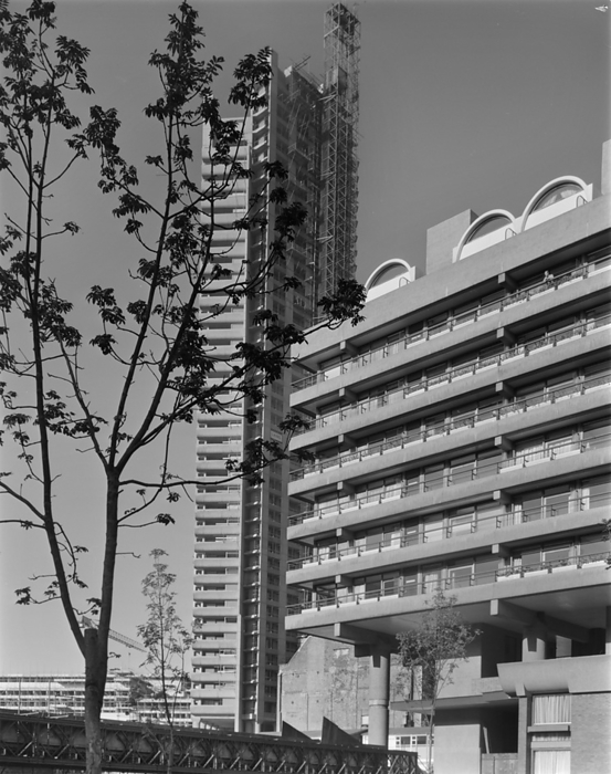 Barbican, City of London, Greater London Authority, 30 10 1969. Creator: John Laing plc. A view looking north west towards the construction of Cromwell Tower on the Barbican development site, with the Speed House terrace block on the right. Work began on building London  x2019 s Barbican development in 1962. The construction of this complex megastructure was designed to be carried out in six phases, with different contractors working on the site. In 1964, John Laing and Son Ltd won the tender for Phase III. Laing were also responsible for the construction of Phase V, which included the Barbican Arts Centre, Frobisher Crescent and the Guildhall School of Music and Drama.