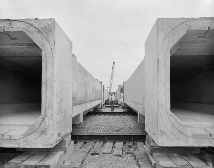 Peel Common Waste Water Treatment Works, Peel Common, Fareham, Hampshire, 06 06 1978. Creator: John Laing plc. A view of large precast concrete units for the Browndown outfall of the Peel Common Sewage Works. Laing Civil Engineering were contracted to construct the Browndown Outfall for the Southern Water Authority, as part of the South Hampshire Main Drainage Scheme for the treatment and disposal of sewage. Browndown Outfall is a 1km long underwater culvert which transports treated sewage from Peel Common Sewage Works, another contract carried out by Laing. The outfall was built in sections which were linked together in a chain on the seabed. The landward section of the outfall was cast in situ in a temporary cofferdam.