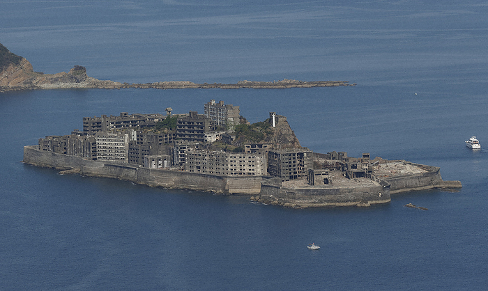 Panoramic view of Hashima Island  Gunkanjima  from the southwest. The highest building is Building No. 3, and the dice shaped building below the lighthouse is Building No. 30. Panoramic view of Hashima Island  Gunkanjima  from the southwest. The tallest building is No. 3, and the dice shaped building below the lighthouse is No. 30.