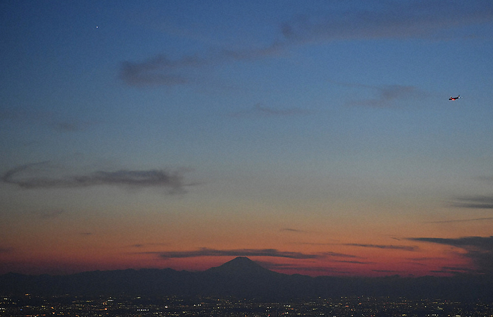 Mt. Fuji silhouetted against the evening sky Fuji, silhouetted in the dusk, in Tokyo at 6:06 p.m. on September 23, 2021, photographed by Noriomi Takeuchi from the headquarters helicopter.