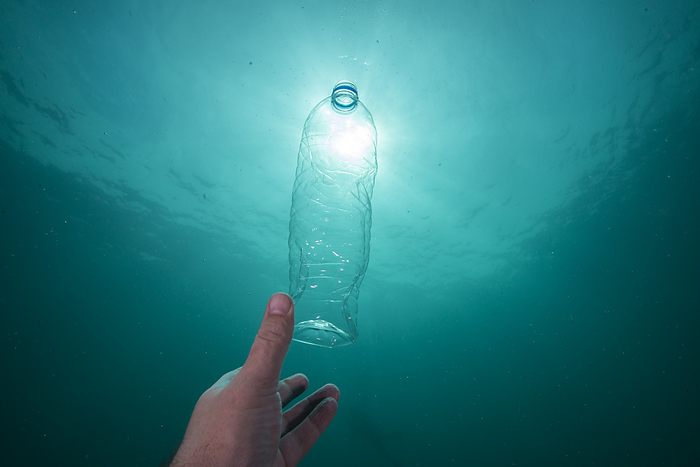 Plastic bottle in ocean Floating mineral water bottle. Plastic pollution like this can be found throughout the waters of South East Asia., Creditline:SCUBAZOO SCIENCE PHOTO LIBRARY