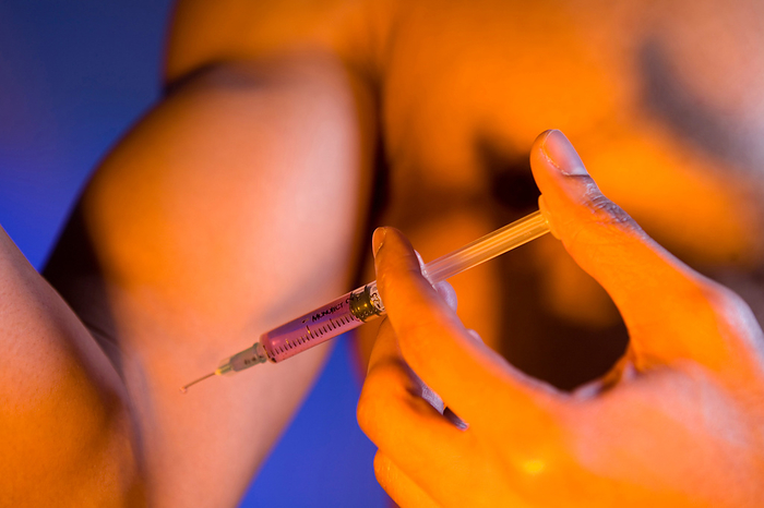 Young man injecting anabolic steroids Young man injecting anabolic steroids into his arm. Anabolic steroids help to speed up muscle recovery after exercise allowing for a more intensive training regime and increasing muscle mass faster., Creditline:MEDICIMAGE   SCIENCE PHOTO LIBRARY