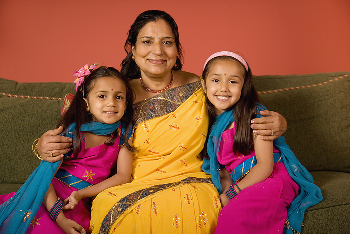 parent and child Indian grandmother and granddaughters in traditional dress