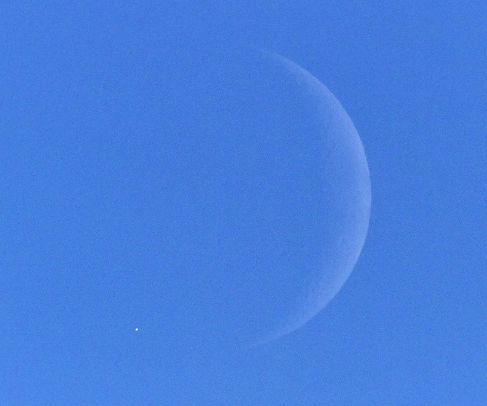 Venus is hidden in the shadow of the crescent moon during a Venus eclipse during the daytime  lower left . Venus  lower left  is hidden by the shadow of the crescent moon during a Venus eclipse during the daytime  photo by Koichiro Tezuka at 1:47 p.m. on November 8, 2021 in Koto ku, Tokyo .