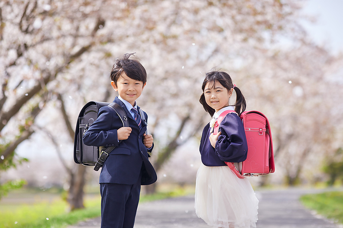 Under the cherry blossoms and Japanese elementary school students